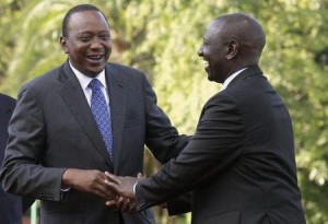 Kenya's President Uhuru Kenyatta (L) shares a moment with his Deputy William Ruto (R) at the State House after Kenyatta's case at the International Criminal Court (ICC) was dropped in the capital Nairobi, December 5, 2014. REUTERS/Thomas Mukoya