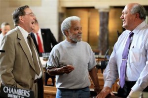 In this May 20, 2015, photo, Nebraska state Sen. Ernie Chambers, an independent, center, jokes with Sen. Al Davis of Hyannis, a Republican, left, and with Sen. Rick Kolowski of Omaha, a Democrat, right. The Nebraska Legislature is comprised of 35 Republicans, 13 Democrats and one independent, but the parties have no control in Nebraskas unusual one-house, nonpartisan Legislature. The speaker of the Legislature sets the agenda and designates certain bills as priorities but cant control whether a bill makes it to the floor and how senators vote. The setup forces lawmakers to build coalitions based on conscience, regional interests or agreements to support one anothers bills. (AP Photo/Nati Harnik)