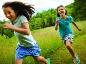 children-playing-in-field-AFP