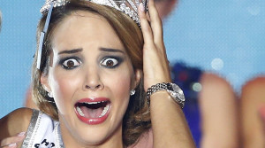 Miss Switzerland 2014 Laetitia Guarino reacts after she won the Miss Switzerland beauty pageant on the Federal Square in Bern October 11, 2014. REUTERS/Ruben Sprich (SWITZERLAND - Tags: ENTERTAINMENT SOCIETY TPX IMAGES OF THE DAY) - RTR49T5F