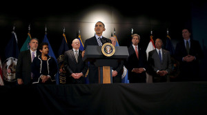 U.S. President Barack Obama delivers a statement at the National Counterterrorism Center in Mclean, Virginia, December 17, 2015. Standing with the President (L-R) are: Nicholas Rasmussen, Director, National Counterterrorism Center, Attorney General Loretta Lynch, James Clapper, Director, Office of National Intelligence, Vice President Joe Biden, Secretary John Kerry, Secretary of Homeland Security Jeh Johnson and James Comey, Director, Federal Bureau of Investigations. REUTERS/Carlos Barria      TPX IMAGES OF THE DAY      - RTX1Z5O8