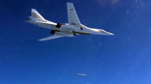 2742644 11/20/2015 A Tu-160 bomber of the Russian Aerospace Defense Forces fires cruise missiles at ISIS targets in the Mediterranean Sea in Syria. (Still from the video published by the Russian Defense Ministry on its official YouTube channel)./Ministry of defence of the Russian Federation